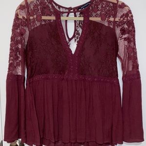 Burgundy American Eagle blouse. size XS. sheer sleeves and back.